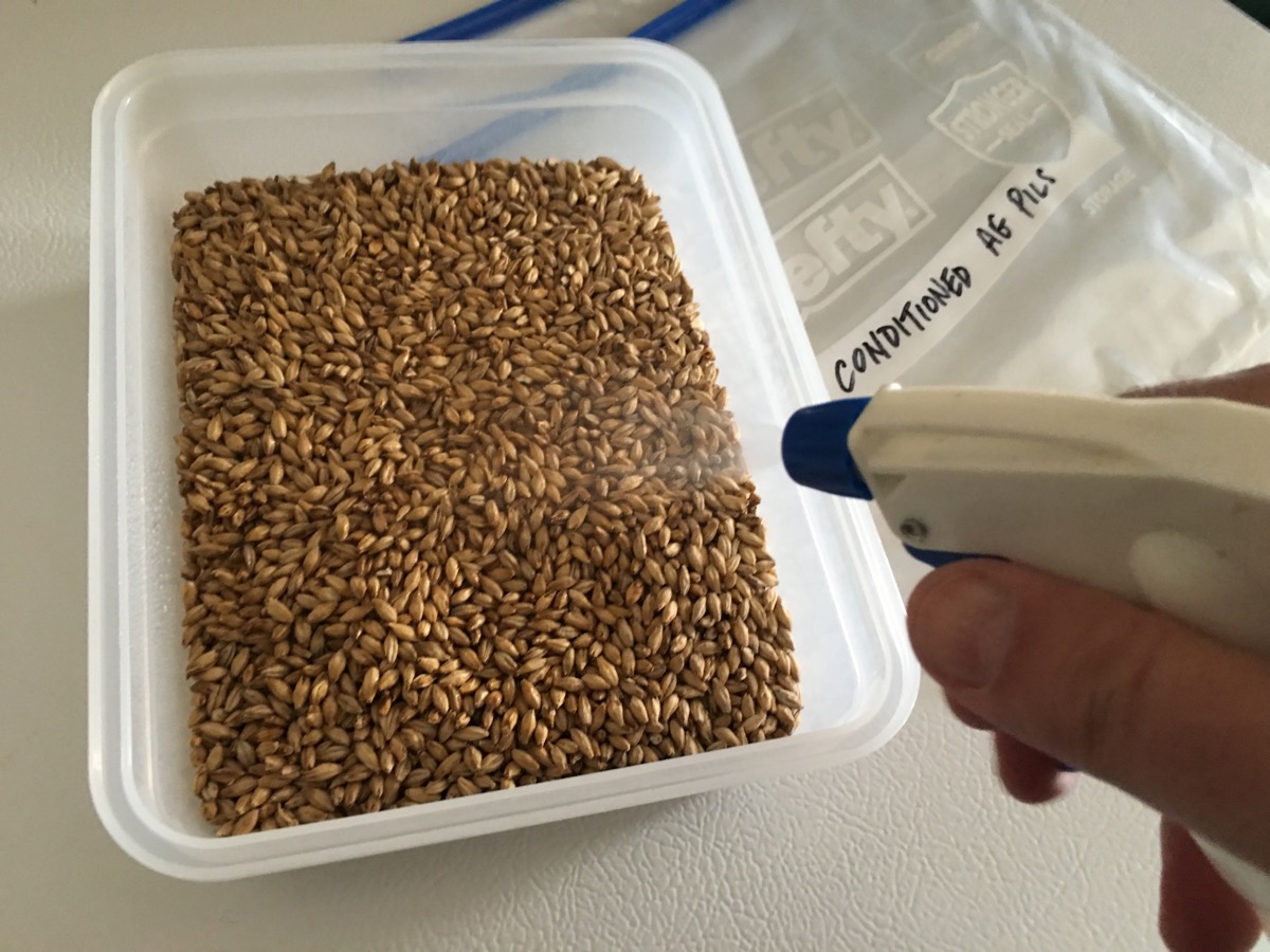 Spraying a mist onto the malt, "Conditioning" before milling.